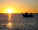 Fishing boat out in the Mediterranean at dawn in Estepona. www.spanishsosimple.com