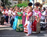 Dancing and singing Sevillanas. La Hermandad de El Rocío. The Brotherhood of El Rocío. Back after their yearly Pilgrimage to El Rocío in Huelva.  www,spanishsosimple.com